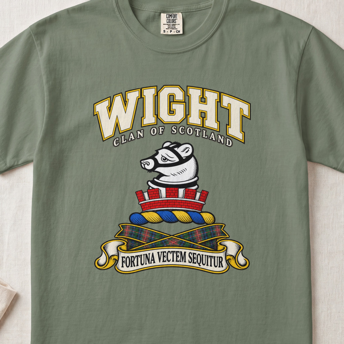 Wight Scottish clan T-shirt in Moss, front view with a white muzzled animal head above a red mural crown and motto design.