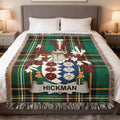 Hickman family crest on a green plaid tartan throw blanket.