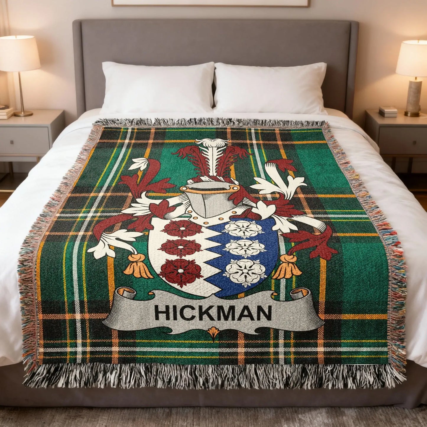 Hickman family crest on a green plaid tartan throw blanket.