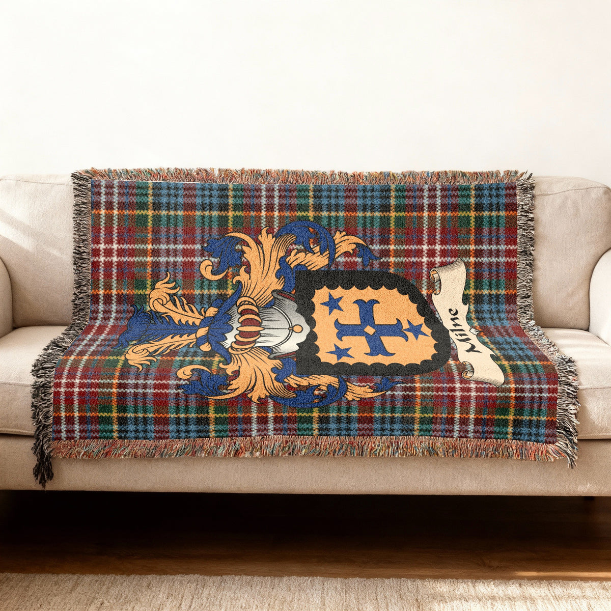 Milne Scottish woven blanket with family shield and Caledonia tartan background