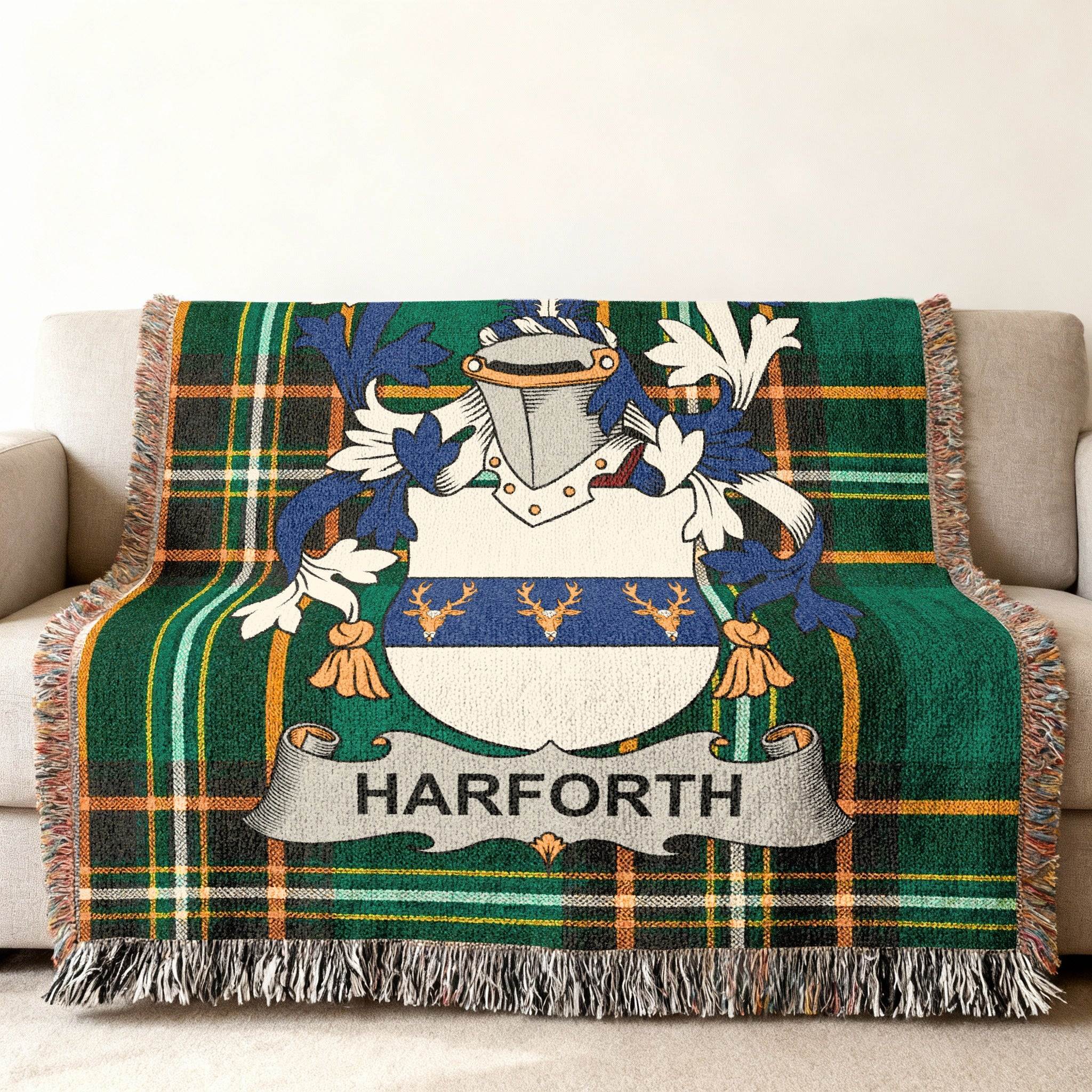 Harforth family crest on a green plaid throw blanket on a couch.