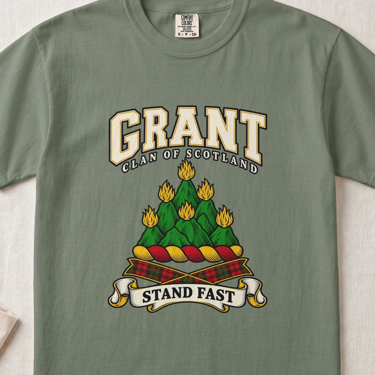 Grant graphic T-shirt in Moss green, front flat lay showing varsity lettering and green mountain-like mound with yellow flames.