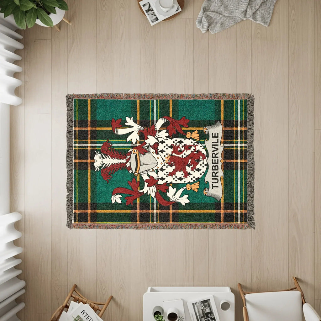 Tartan rug with the Turburville coat of arms and fringe detail.