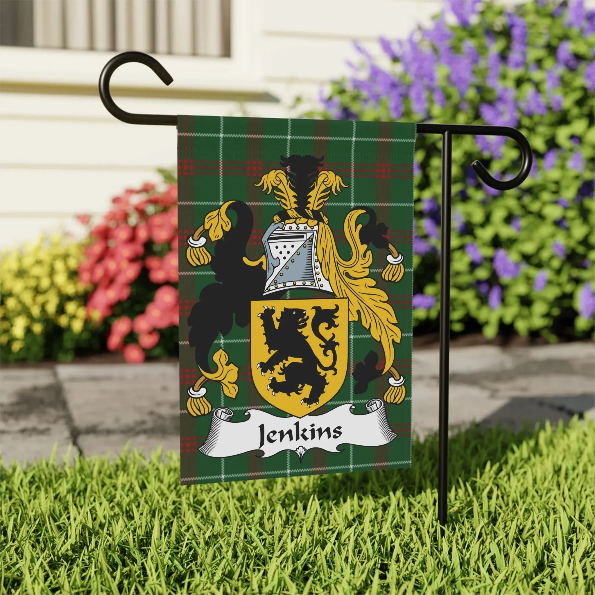 Jenkins family crest on a green tartan plaid garden flag.
