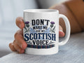 White mug with "Don't make me use my Scottish voice" text and thistle design.