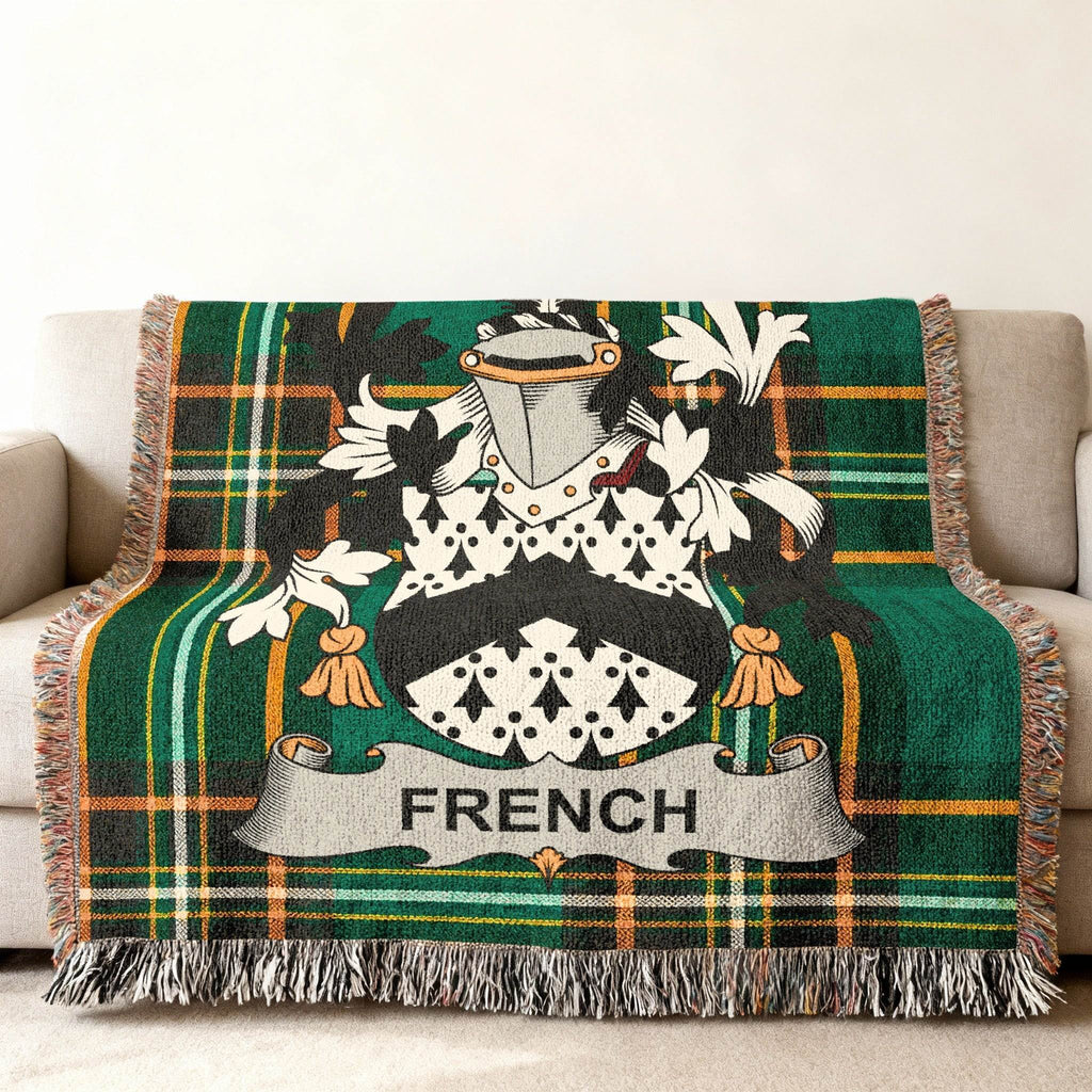 Woven throw blanket with green plaid and the French family crest.