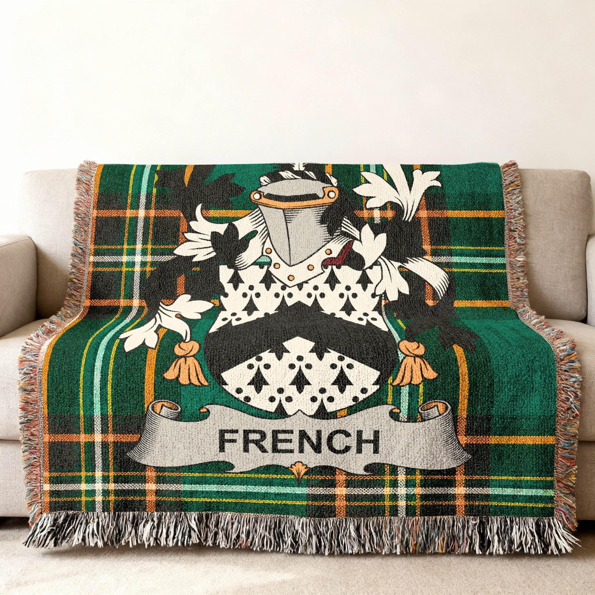 Woven throw blanket with green plaid and the French family crest.