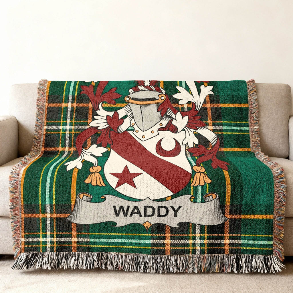 Green tartan blanket with the WADDY family crest displayed.