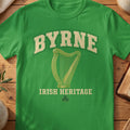 Byrne Irish harp T-shirt in Irish Green, with cream surname lettering, a gold-toned harp, green shamrock and “Irish Heritage” text.