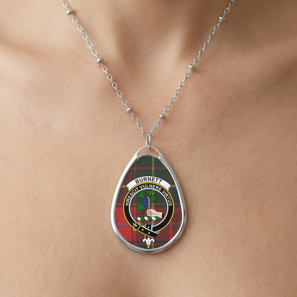 Close-up of Burnett clan tartan pendant necklace with crest design
