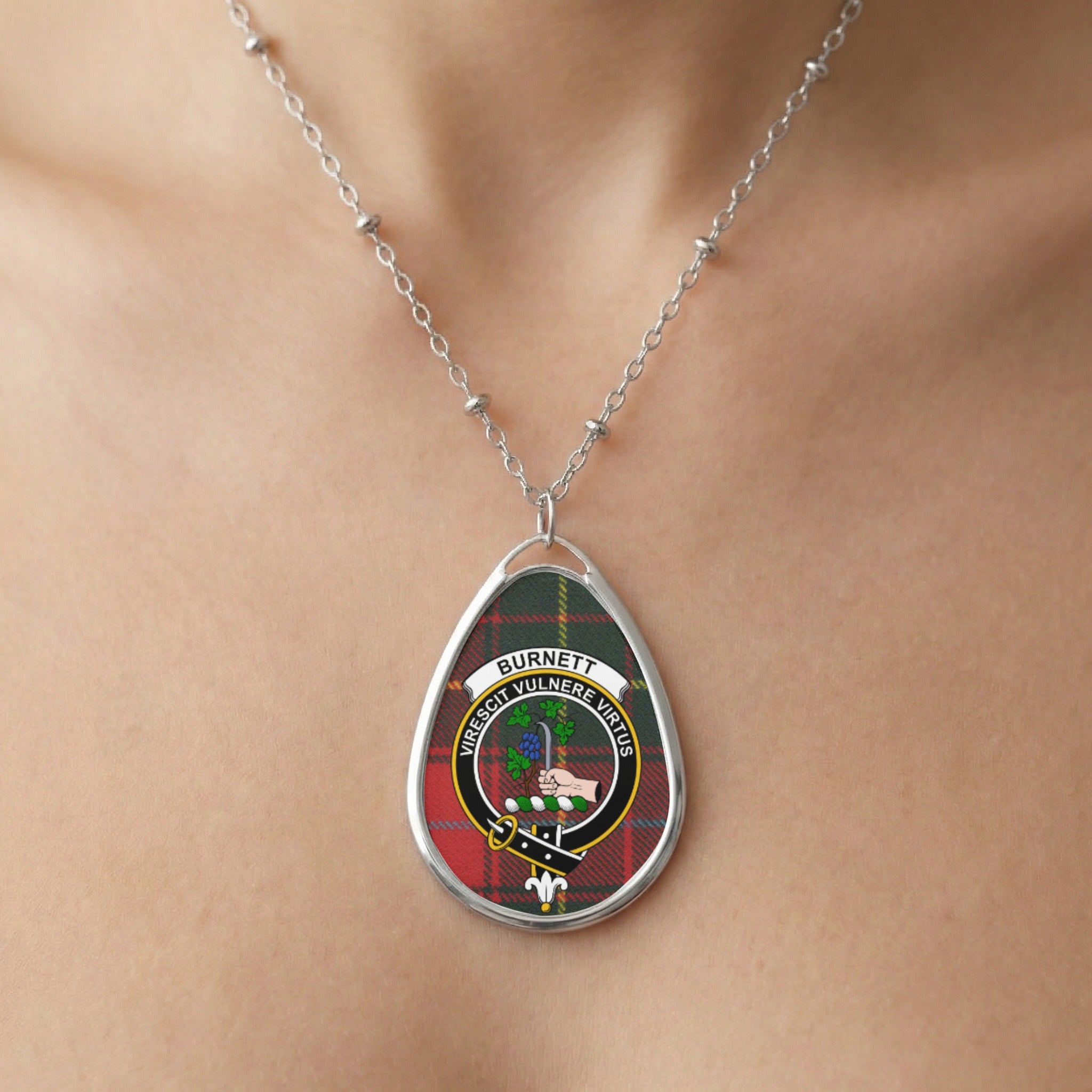 Close-up of Burnett clan tartan pendant necklace with crest design