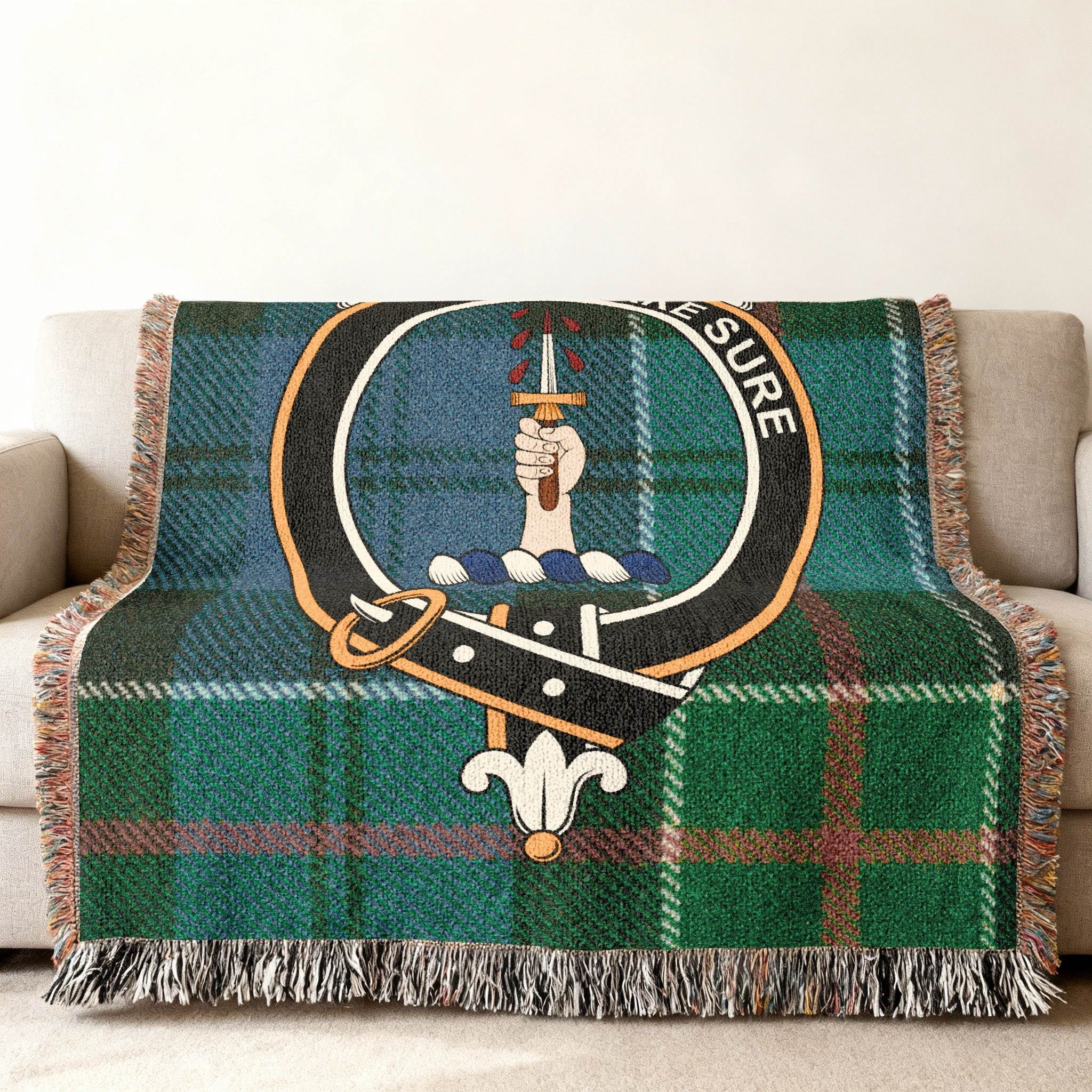 Clan Kirkpatrick woven blanket — 80x60 inch full size, Kirkpatrick crest and tartan on sofa display