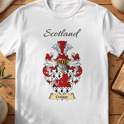 White Craigge Scottish family shield T-shirt featuring a red figure against a black-and-white patterned shield