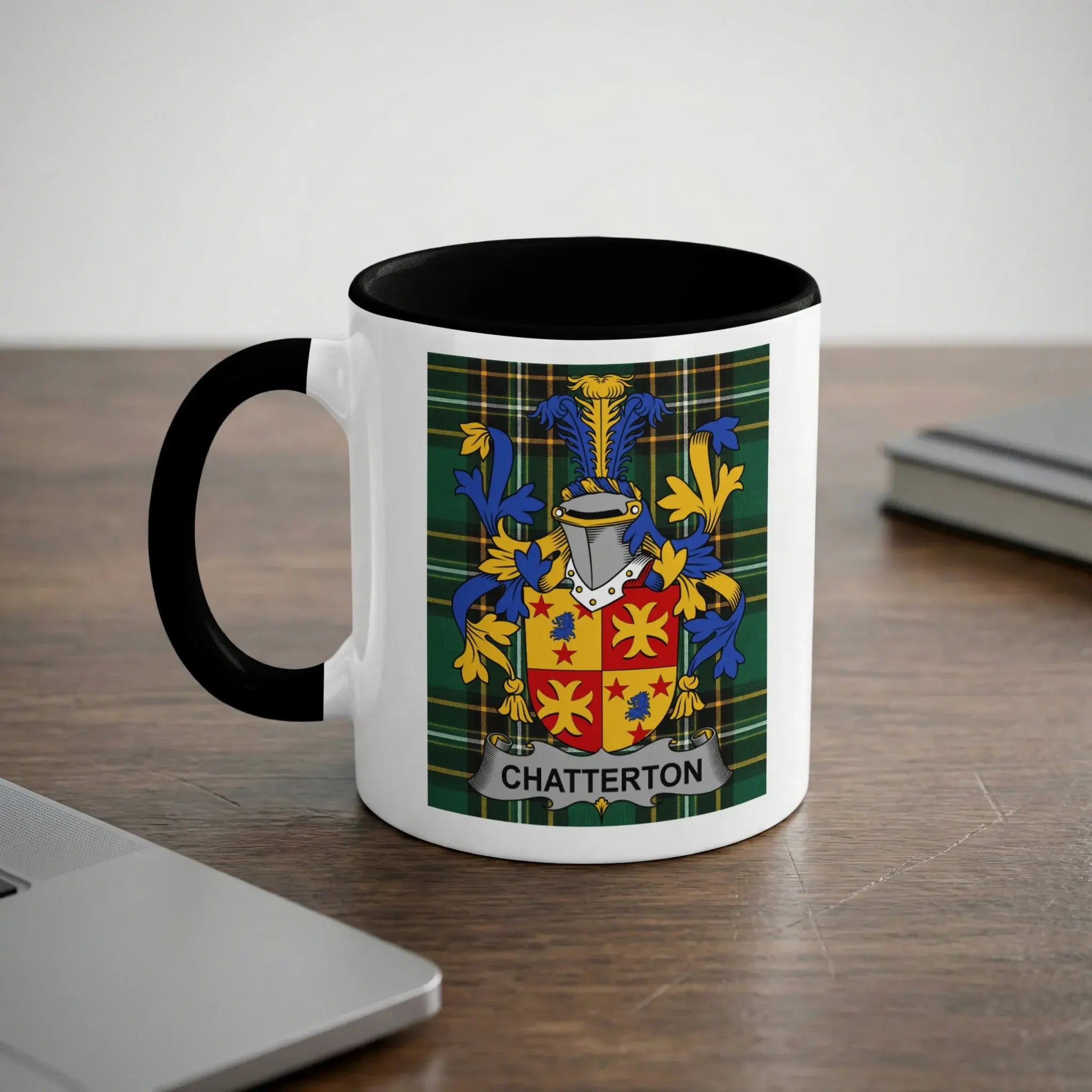 Mug with the Chatterton family crest on a wooden desk.