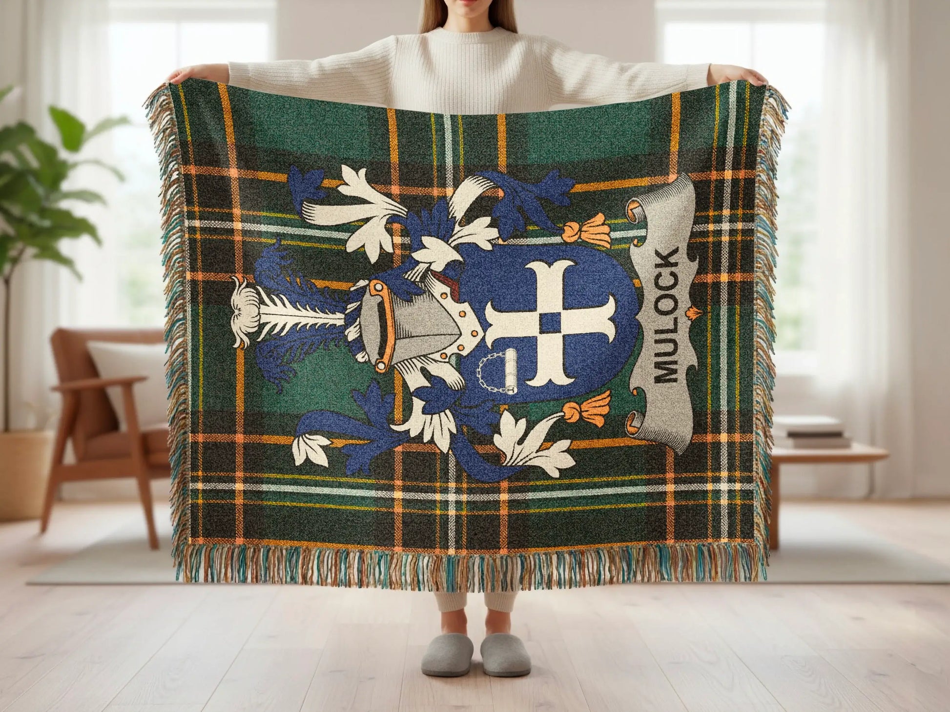 Plaid throw blanket with Mulock family crest in blue, white, and gray.