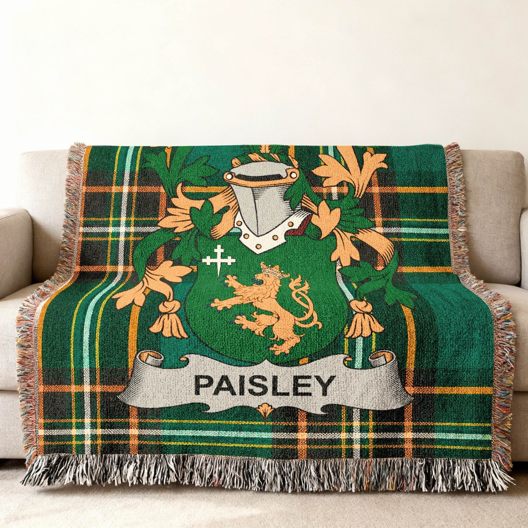 Green tartan blanket with Paisley family crest and lion rampant.