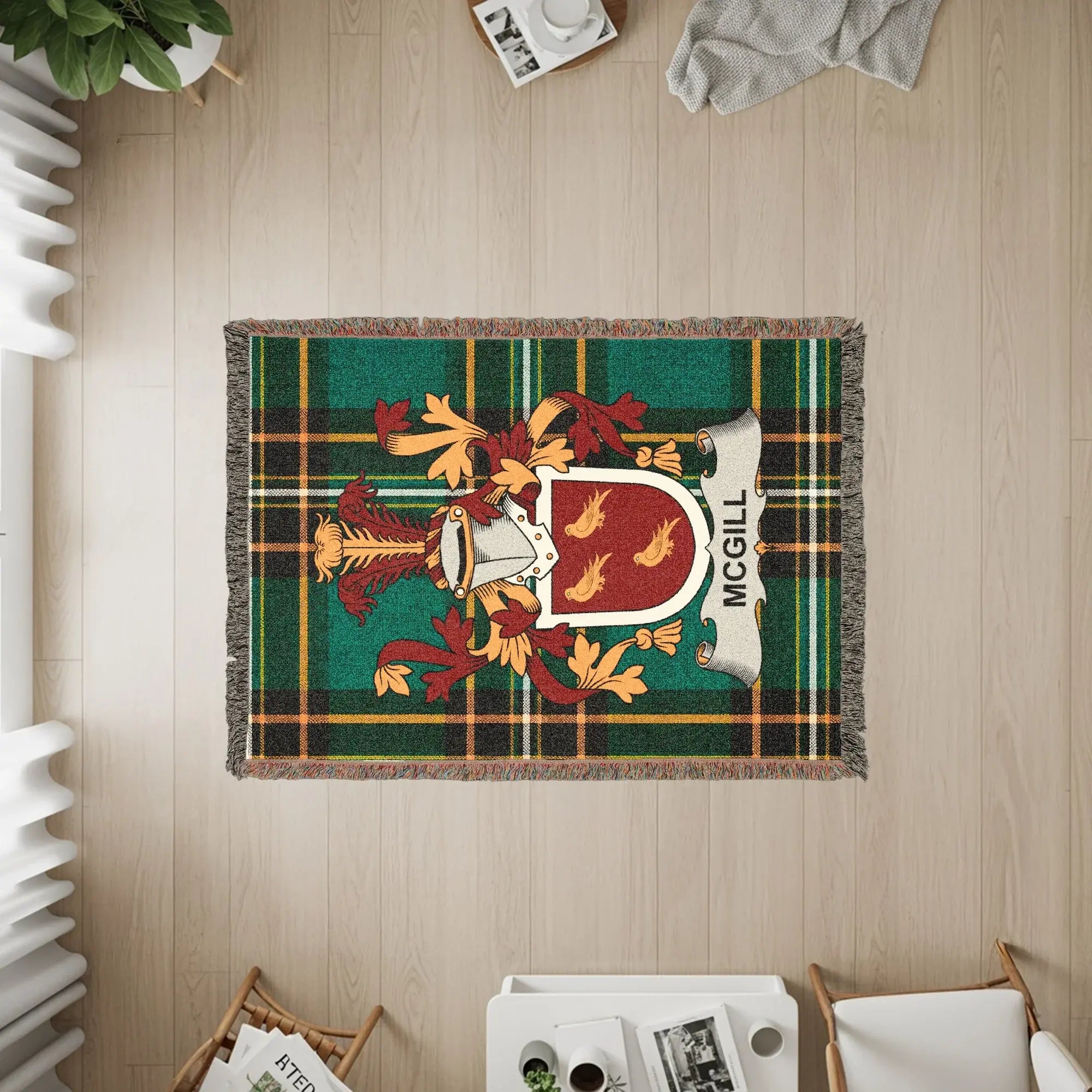 McGill clan crest on a green plaid woven blanket.