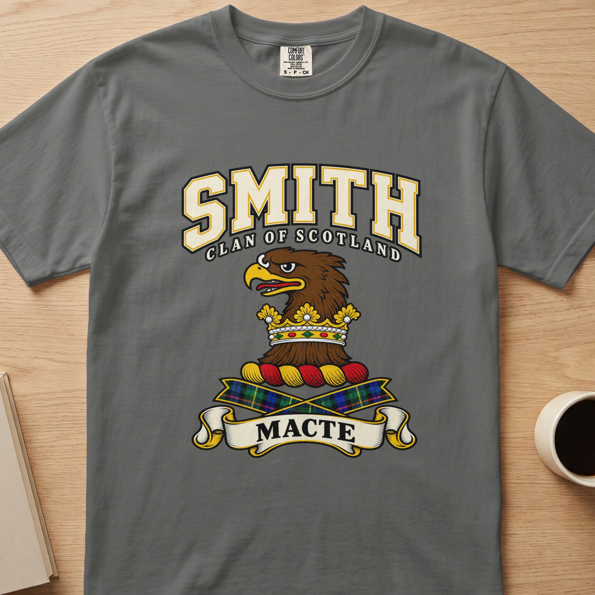 Smith brown eagle-head crest with gold accents graphic on a charcoal gray Comfort Colors T-shirt, front view
