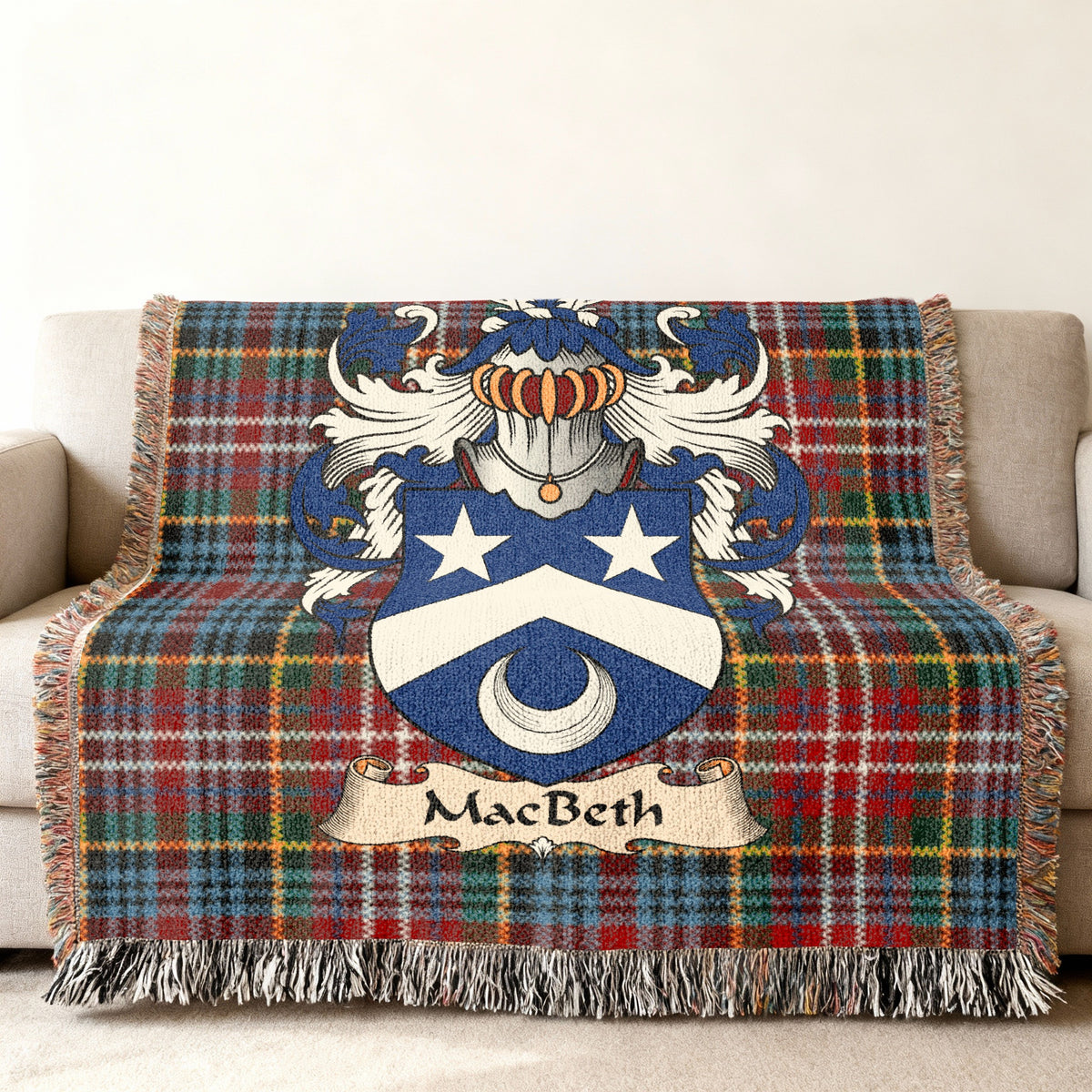 MacBeth family crest emblem on a Caledonia tartan woven blanket