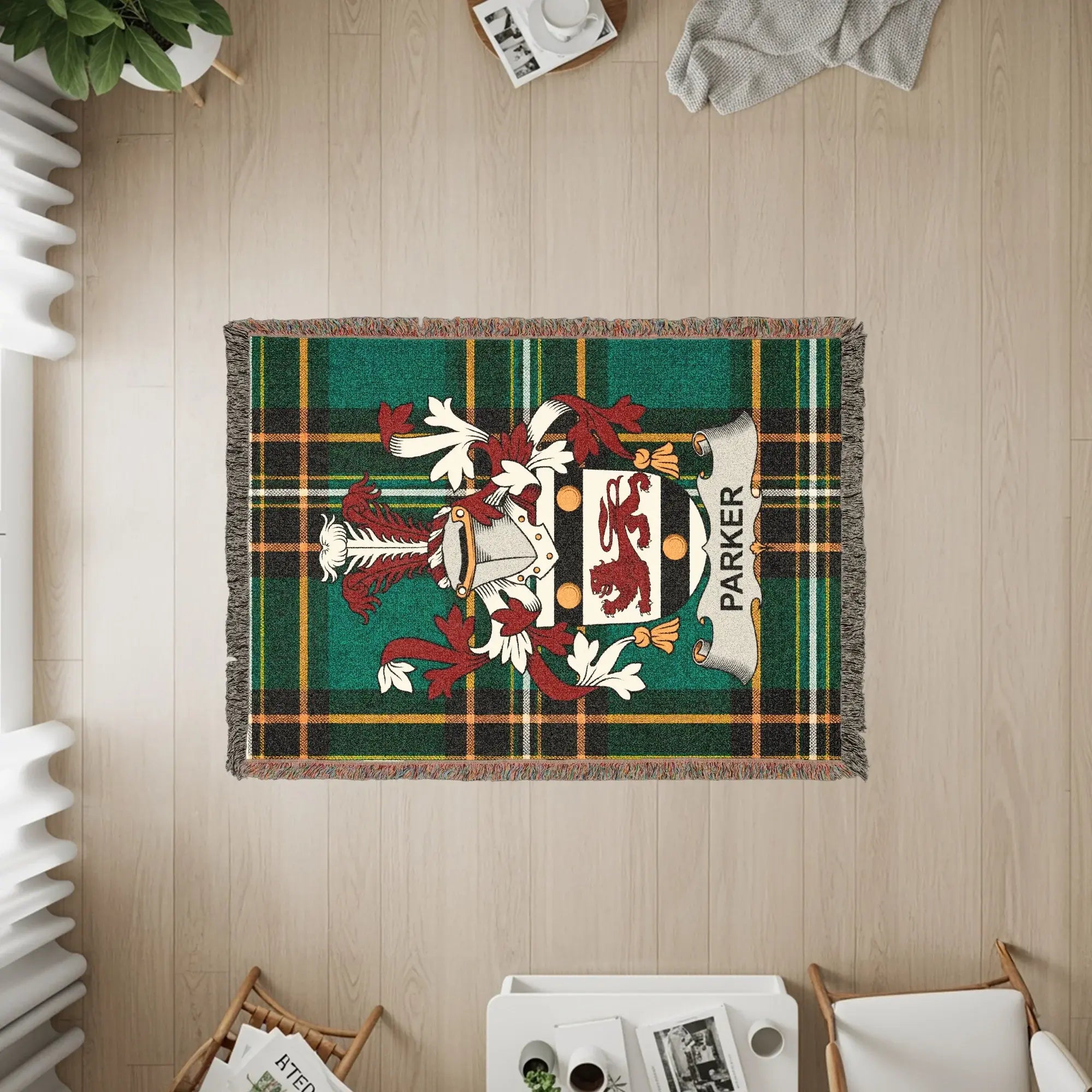 Green tartan plaid woven throw with Parker coat of arms and text.