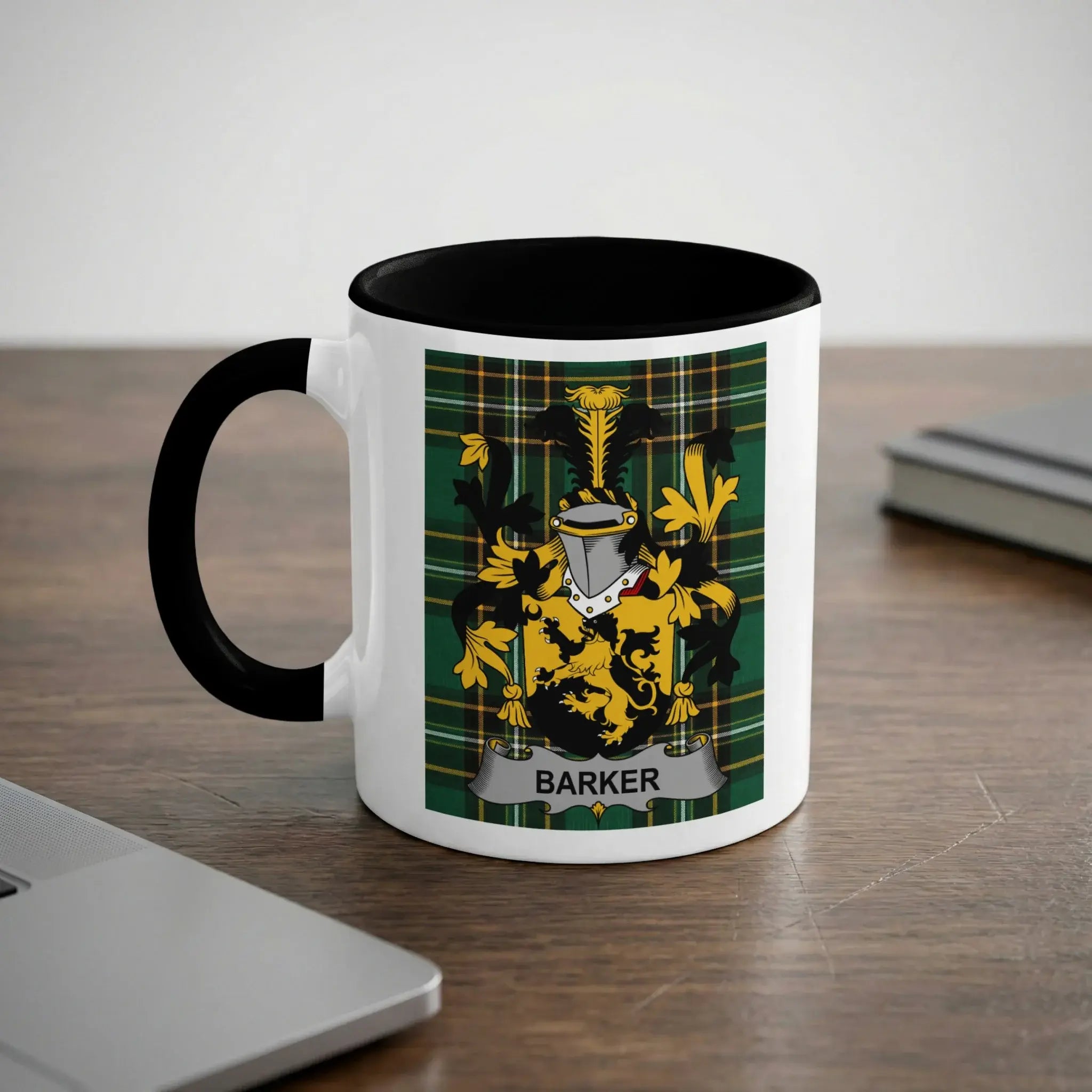 White mug with black rim featuring a green plaid coat of arms with a banner reading "BARKER".