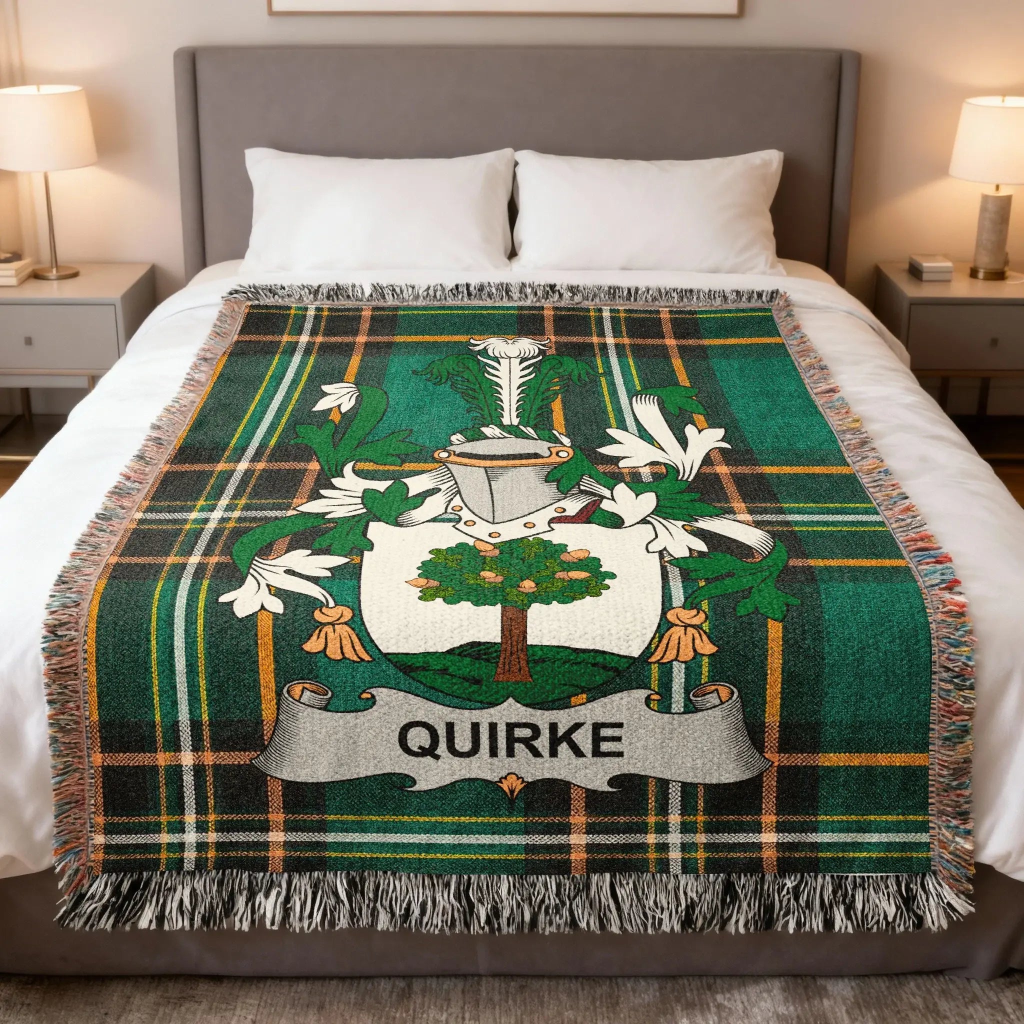 Green tartan blanket featuring a family crest with the name "QUIRKE."