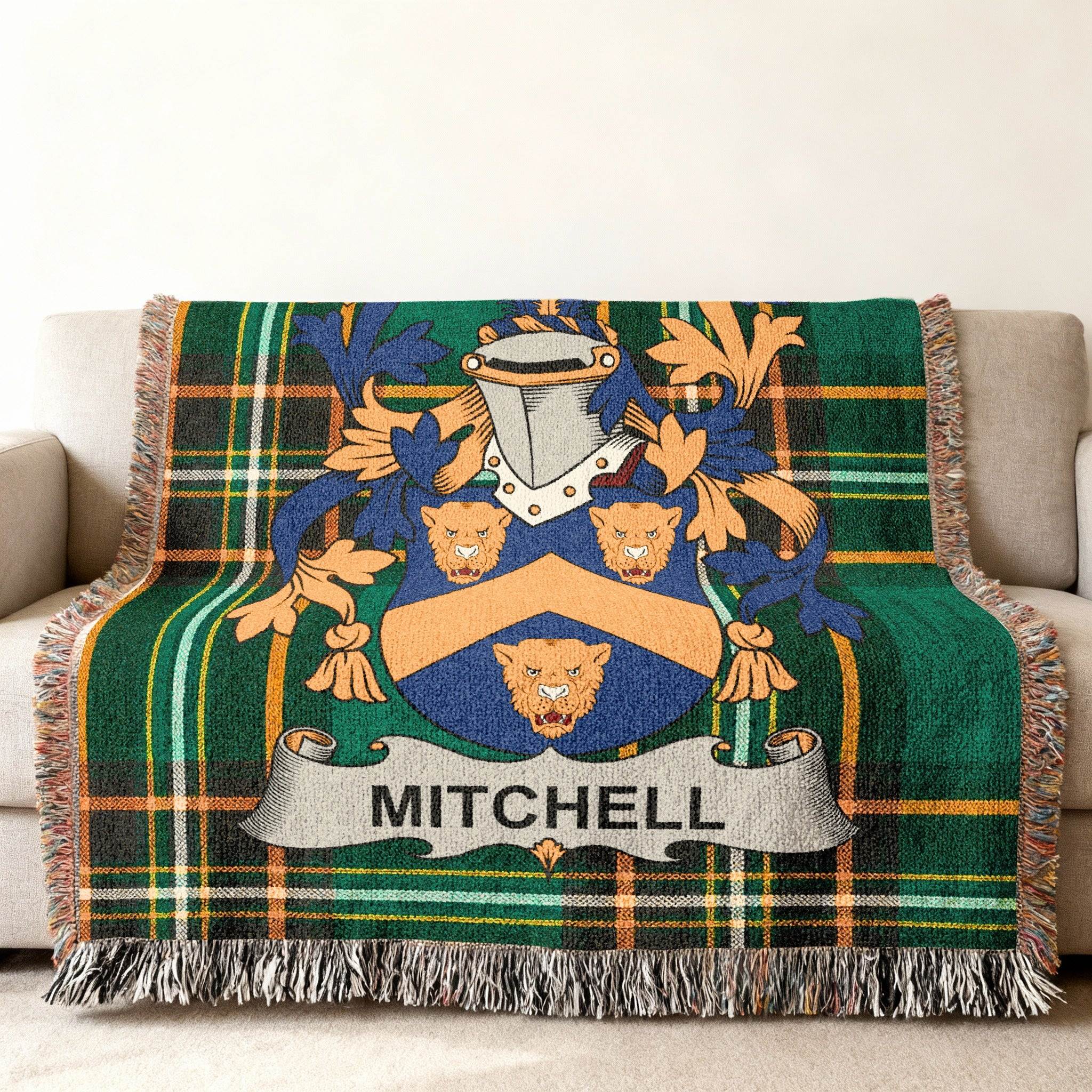 Green plaid throw blanket with Mitchell family crest.
