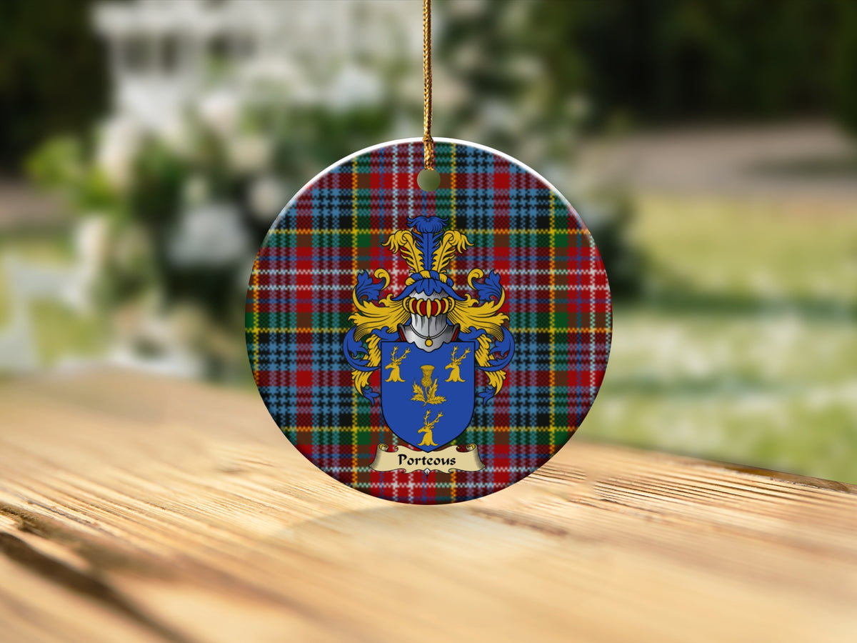 Round Porteous Scottish clan ornament with family crest on a Caledonia tartan background