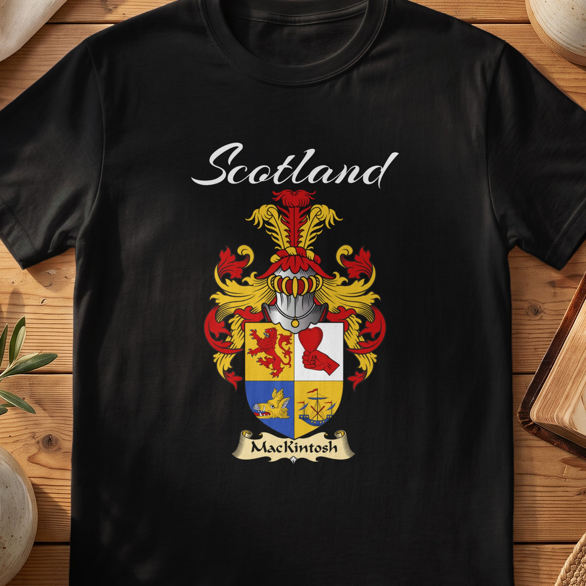 Black MacKintosh Scottish T-shirt featuring a quartered red, gold and blue shield