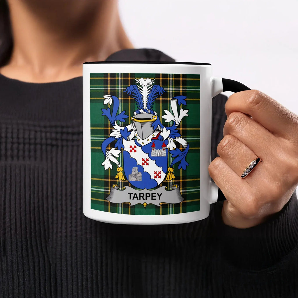 Mug with Tarpey coat of arms on plaid background.