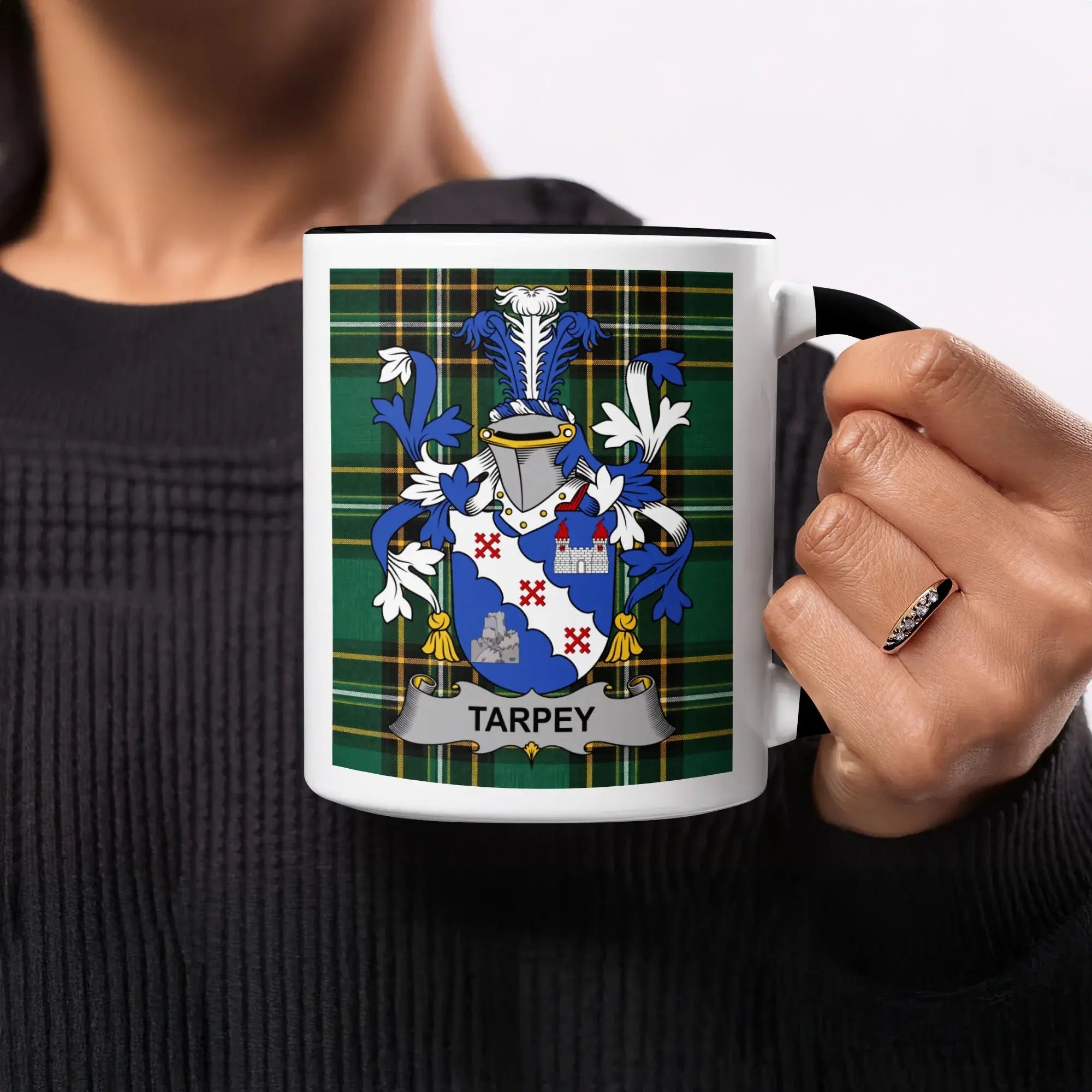 Mug with Tarpey coat of arms on plaid background.