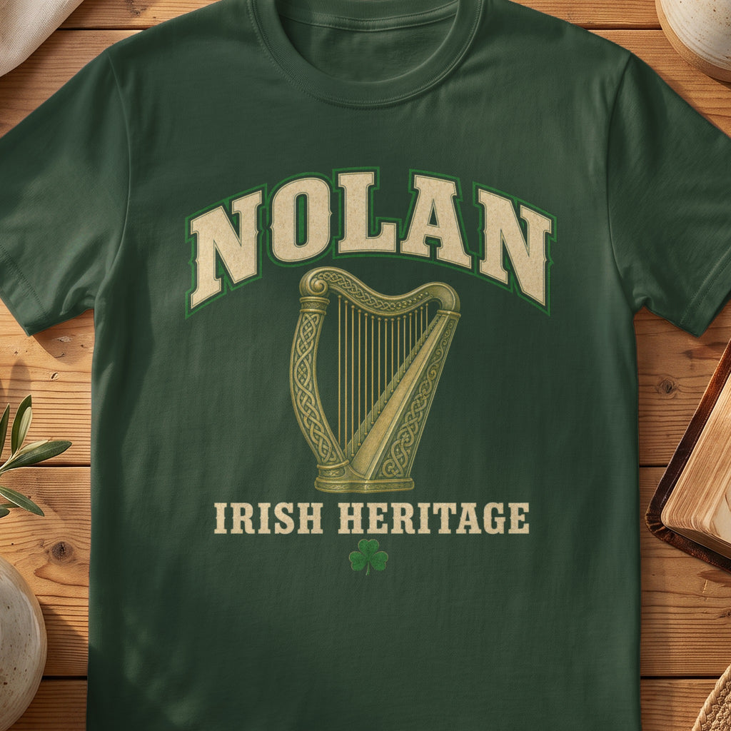 Nolan Irish harp T-shirt in Forest Green, with cream surname lettering, a gold-toned harp, green shamrock and “Irish Heritage” text.