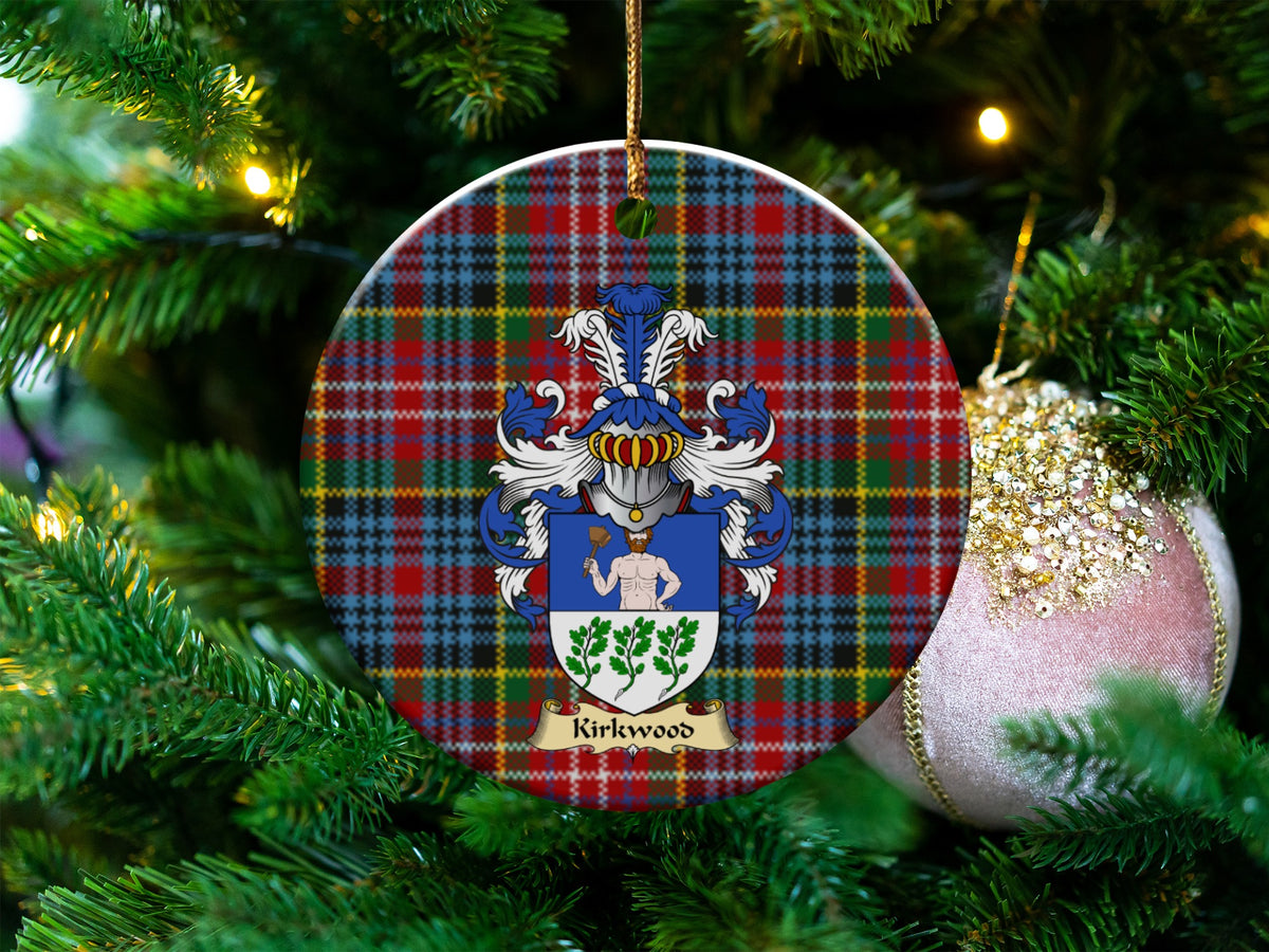 Kirkwood Scottish clan ceramic ornament with family crest on a Caledonia tartan background, hanging on a Christmas tree