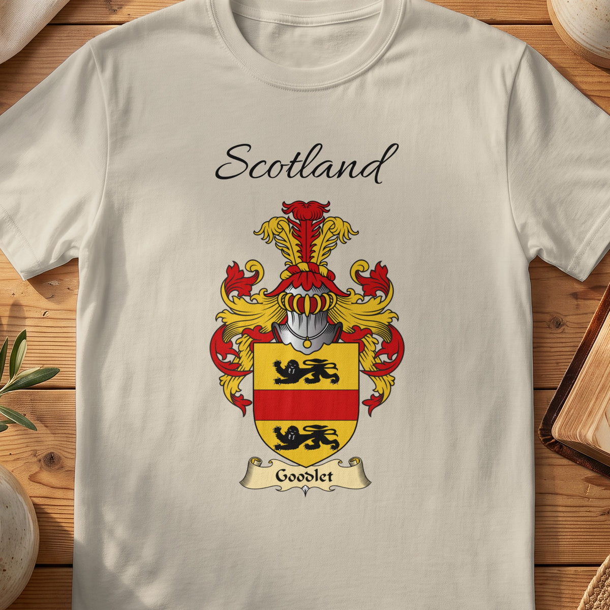 Sand Goodlet Scottish family shield T-shirt featuring a black lions separated by a red band on gold