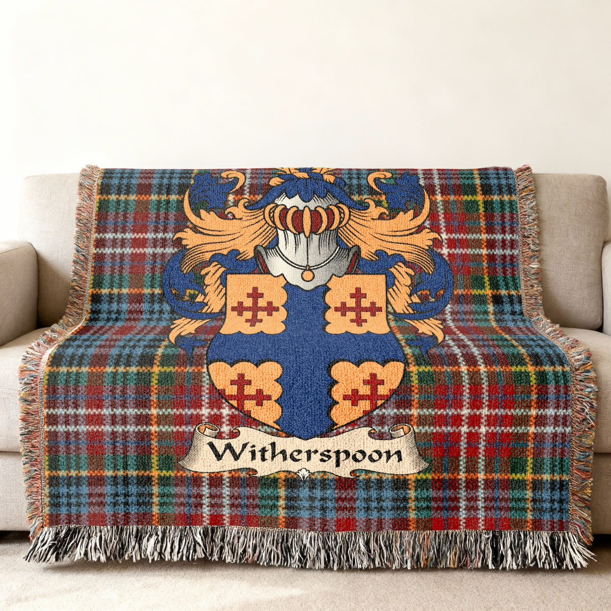 Witherspoon Scottish family shield woven blanket on a Caledonia tartan background