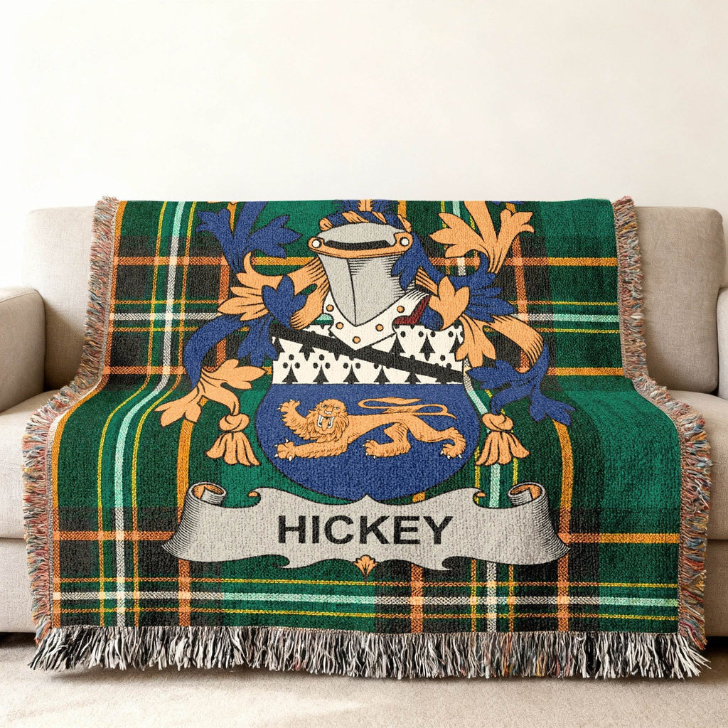 Woven blanket with green plaid and Hickey family crest.