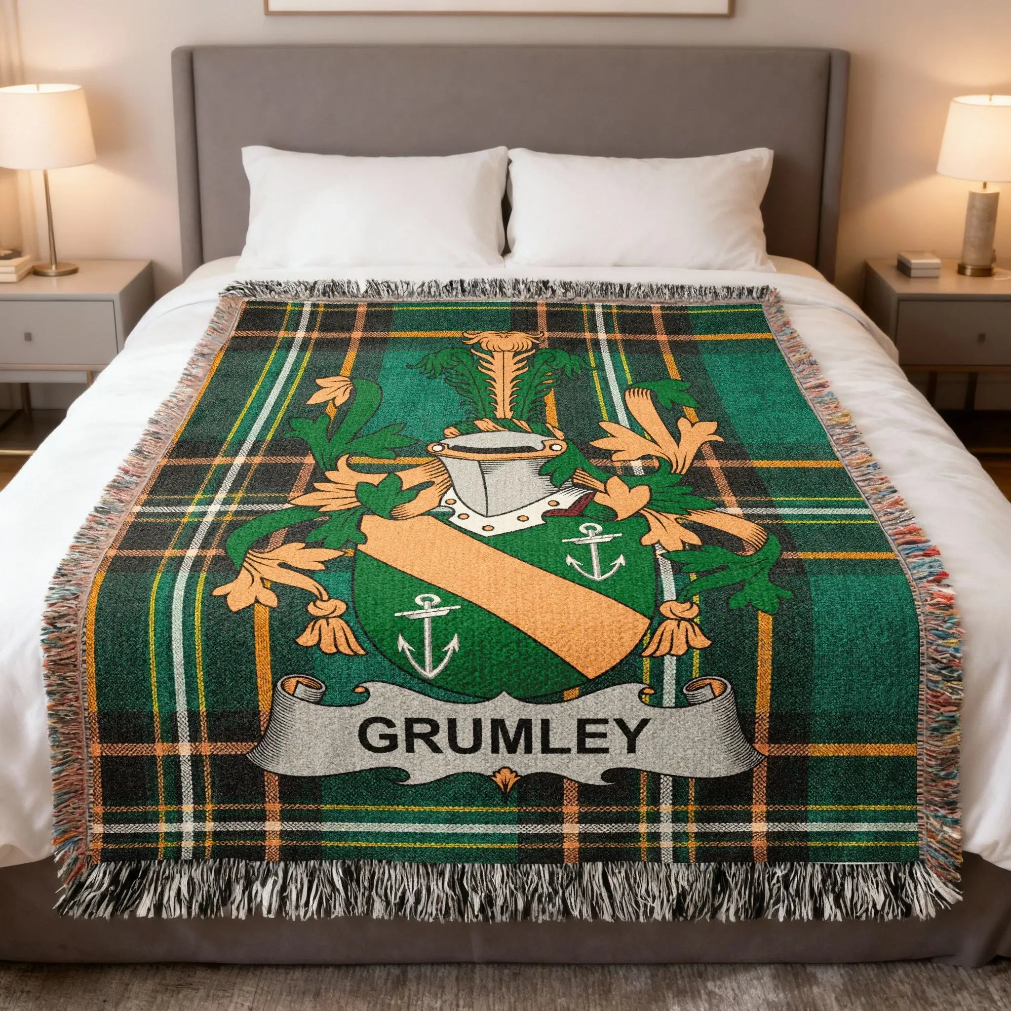 Green plaid blanket with GRUMLEY family crest on a bed.