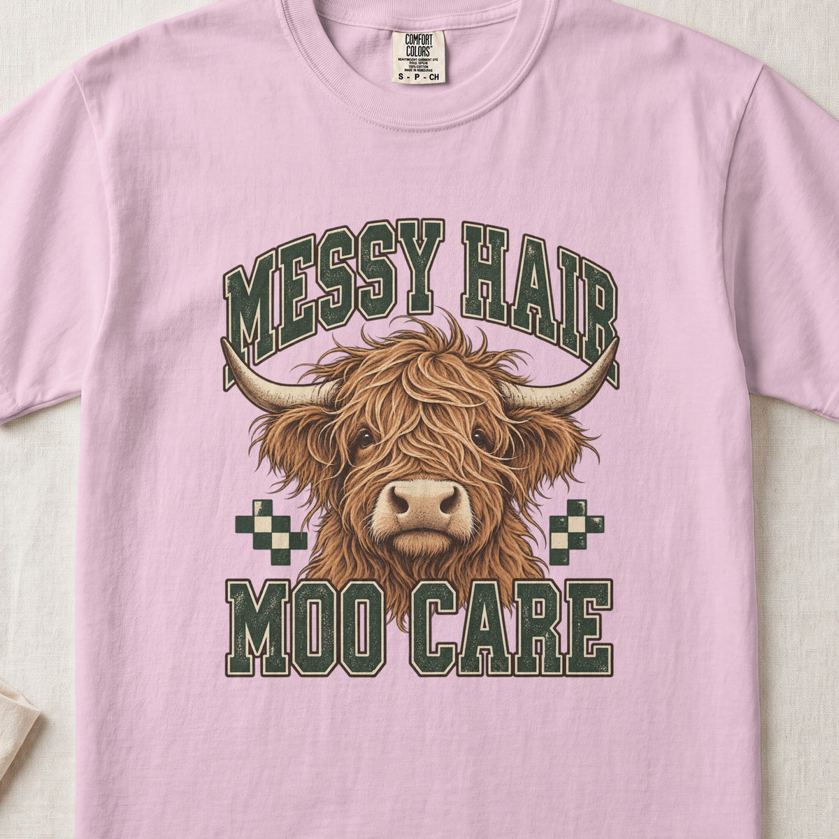 Messy Hair, Moo Care Highland cow design on a Blossom Comfort Colors 1717 T-shirt, flat lay
