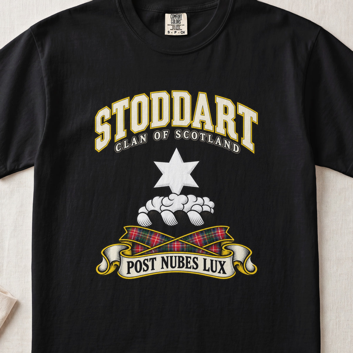 Stoddart Scottish clan T-shirt in Black, front view with a white six-pointed star above clouds and motto design.