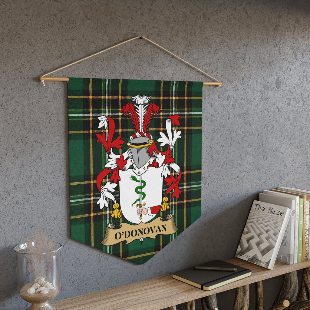 O'Donovan family crest on green tartan pennant hanging on a wall.