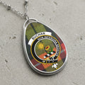 Buchan clan Scottish tartan necklace with clan crest and Non Inferiora Secutus motto on tartan background