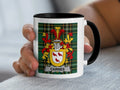 Mug featuring the CARNES family crest on a green tartan background.