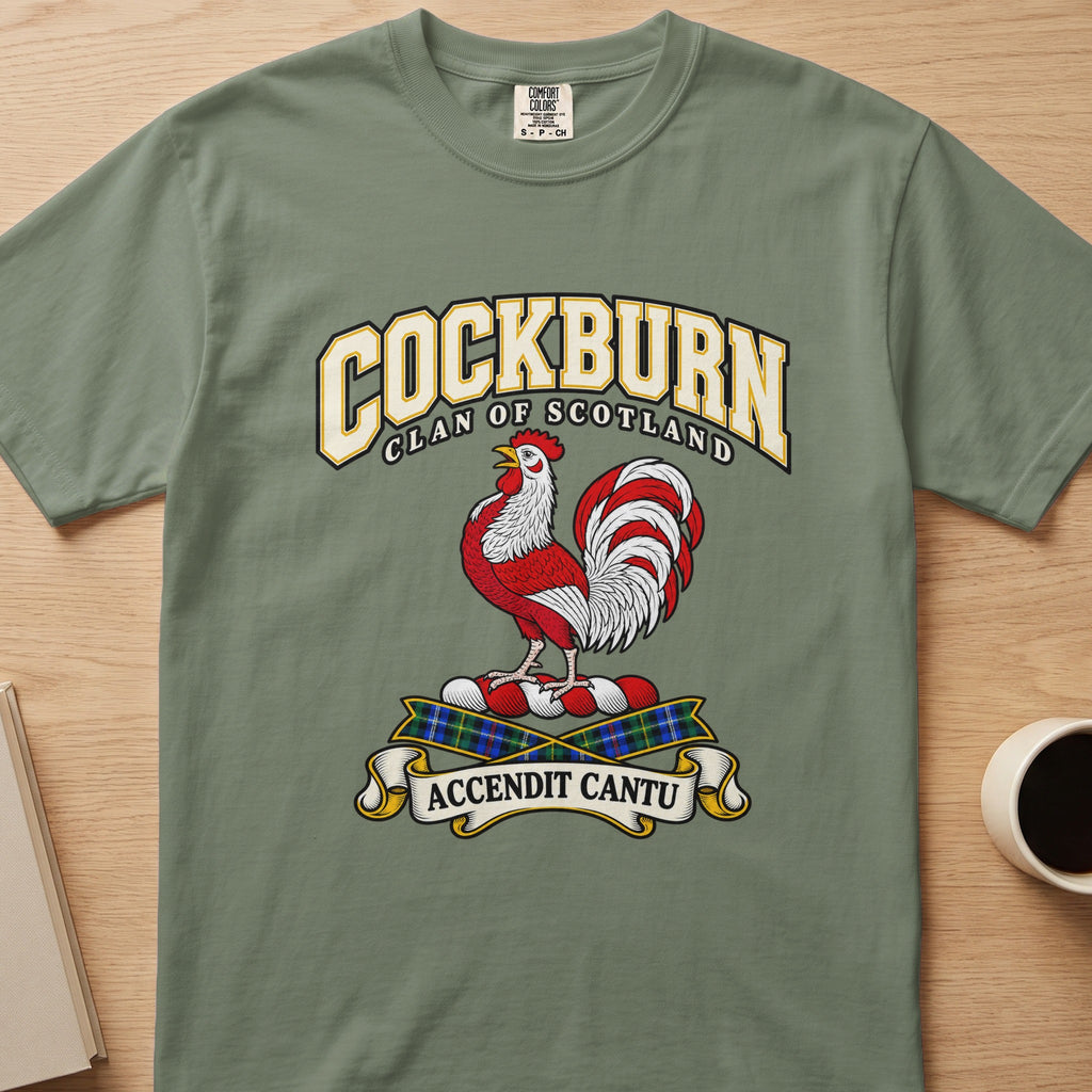 Cockburn red-and-white rooster crest graphic on a sage green Comfort Colors T-shirt, front view