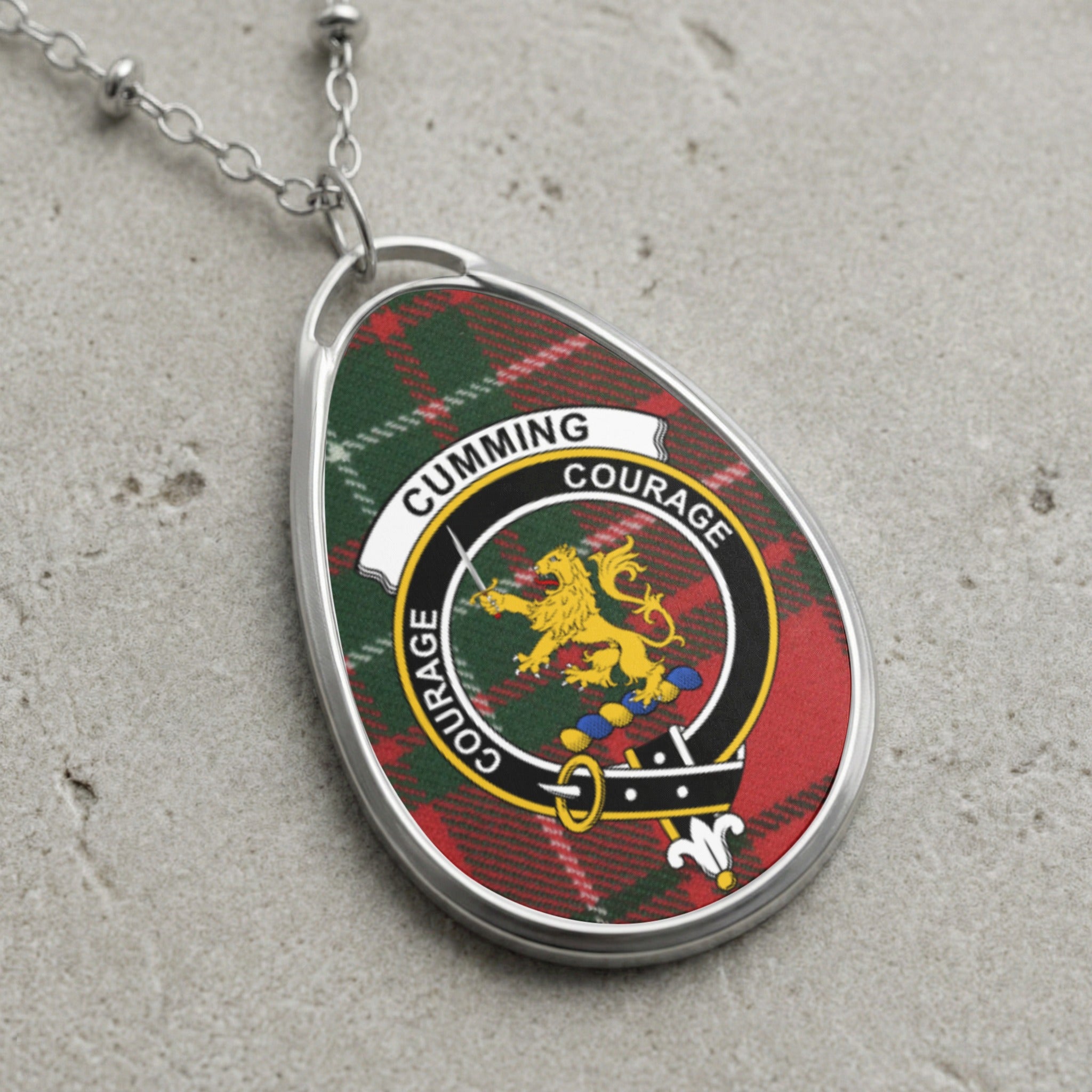 Cumming clan Scottish tartan necklace with clan crest on tartan background