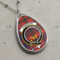 Cameron clan Scottish tartan necklace with clan crest and Aonaibh Ri Cheile motto on tartan background