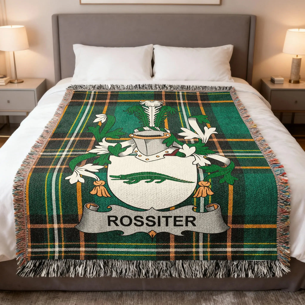 Green tartan blanket with white Rossiter family crest.