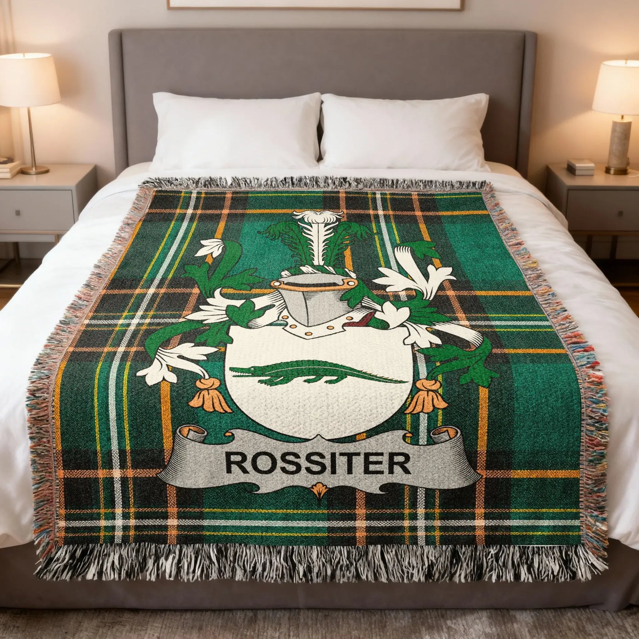 Green tartan blanket with white Rossiter family crest.