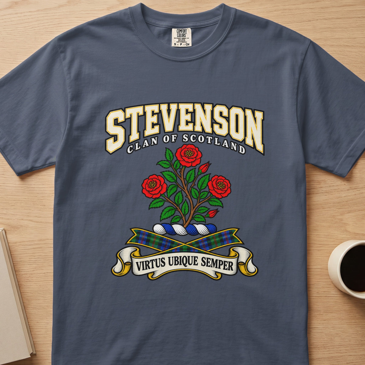 Stevenson three red roses and leafy stems graphic on a slate blue Comfort Colors T-shirt, front view