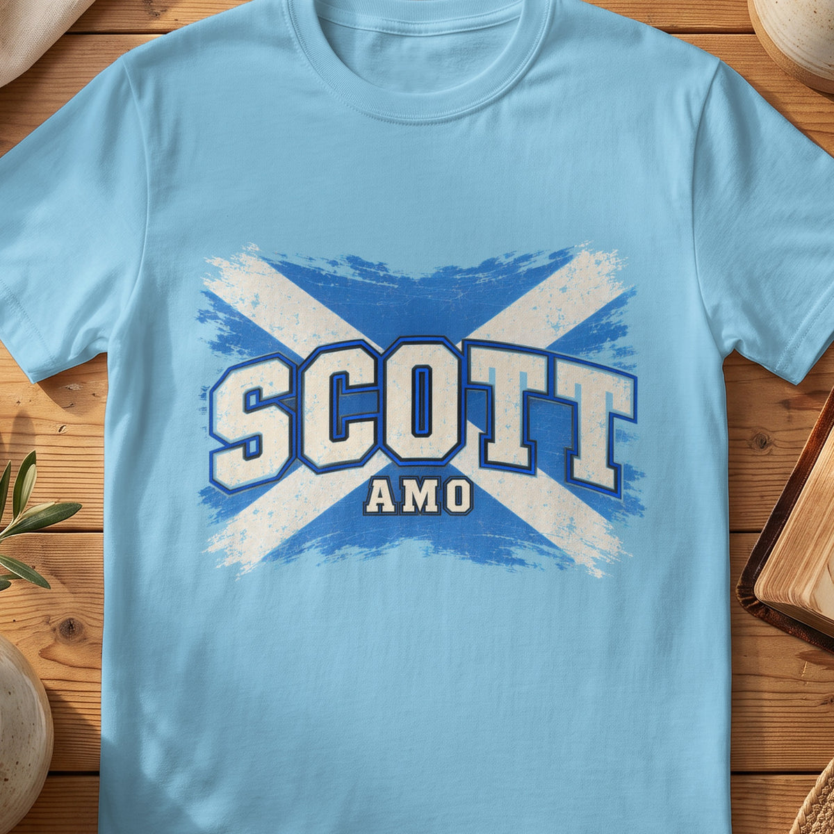 Scott Scottish Saltire T-shirt in Sky, with distressed blue and cream flag and “Amo” lettering.