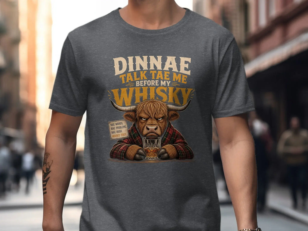 Highland cow in shirt holding whisky, text "Dinnae talk the me before my whisky".